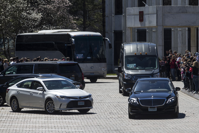 Russian diplomats expelled by the US after a nerve agent attack on a former spy, leave their embassy in Washington, D.C, March 31, 2018.   Along with the family members a total of 171 people will leave the United States on Saturday on two planes. / AFP PHOTO / ZACH GIBSON