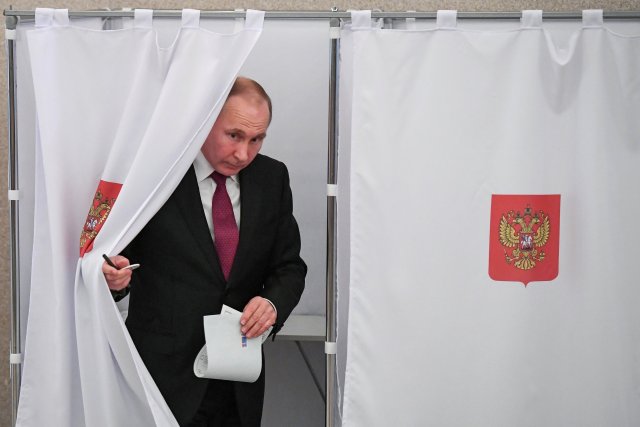 Russian President and Presidential candidate Vladimir Putin at a polling station during the presidential election in Moscow, Russia March 18, 2018. Yuri Kadobnov/POOL via Reuters TPX IMAGES OF THE DAY