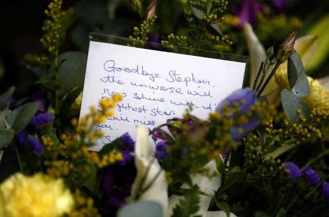 A floral tribute left outside Great St Marys Church, where the funeral of theoretical physicist Prof Stephen Hawking is being held, in Cambridge, Britain, March 31, 2018. REUTERS/Henry Nicholls