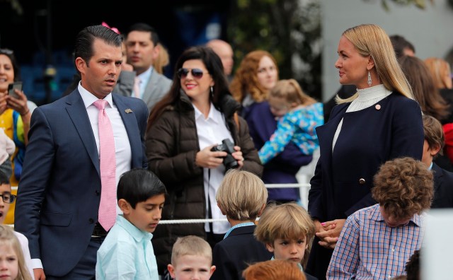 Donald Trump Jr stands near his estranged wife Vanessa, who recently filed for divorce, as they attend the annual White House Easter Egg Roll with their children on the South Lawn of the White House in Washington, U.S., April 2, 2018. REUTERS/Carlos Barria