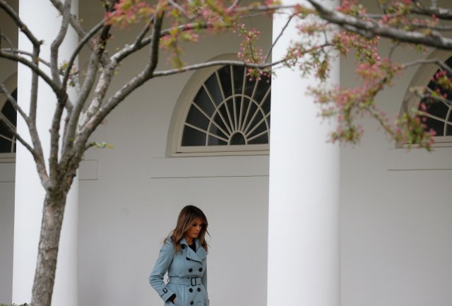 First lady Melania Trump walks by the rose garden after attending the annual White House Easter Egg Roll on the South Lawn of the White House in Washington, April 2, 2018. REUTERS/Leah Millis