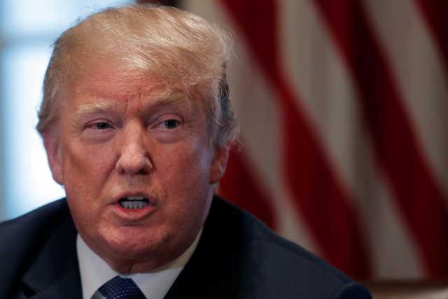 U.S. President Donald Trump receives a briefing from senior military leadership at the Cabinet Room of the White House in Washington, DC, U.S. April 9, 2018. REUTERS/Carlos Barria